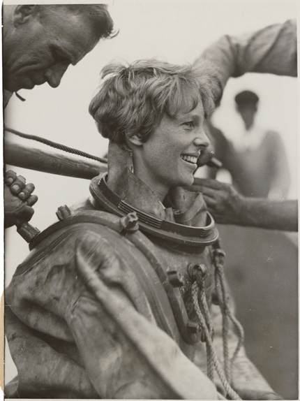 Photograh, "Amelia Earhart deep sea diving off Block Island" Back 07/25/1929 Record Group 306 Records of the U.S. Information Agency Still Photos ID #306-NT-279C-34 Caption on back: "656265-AN AVIATOR LEARNS THE THRILLS OF DEEP DIVING. BLOCK ISLAND- MISS AMELIA EARHART, STILL THE ONLY WOMAN TO FLY THE ATLANTIC, EMERGES FROM THE BOTTOM OF THE SEA OFF BLOCK ISLAND. 7/25/29." 14796_2007_001